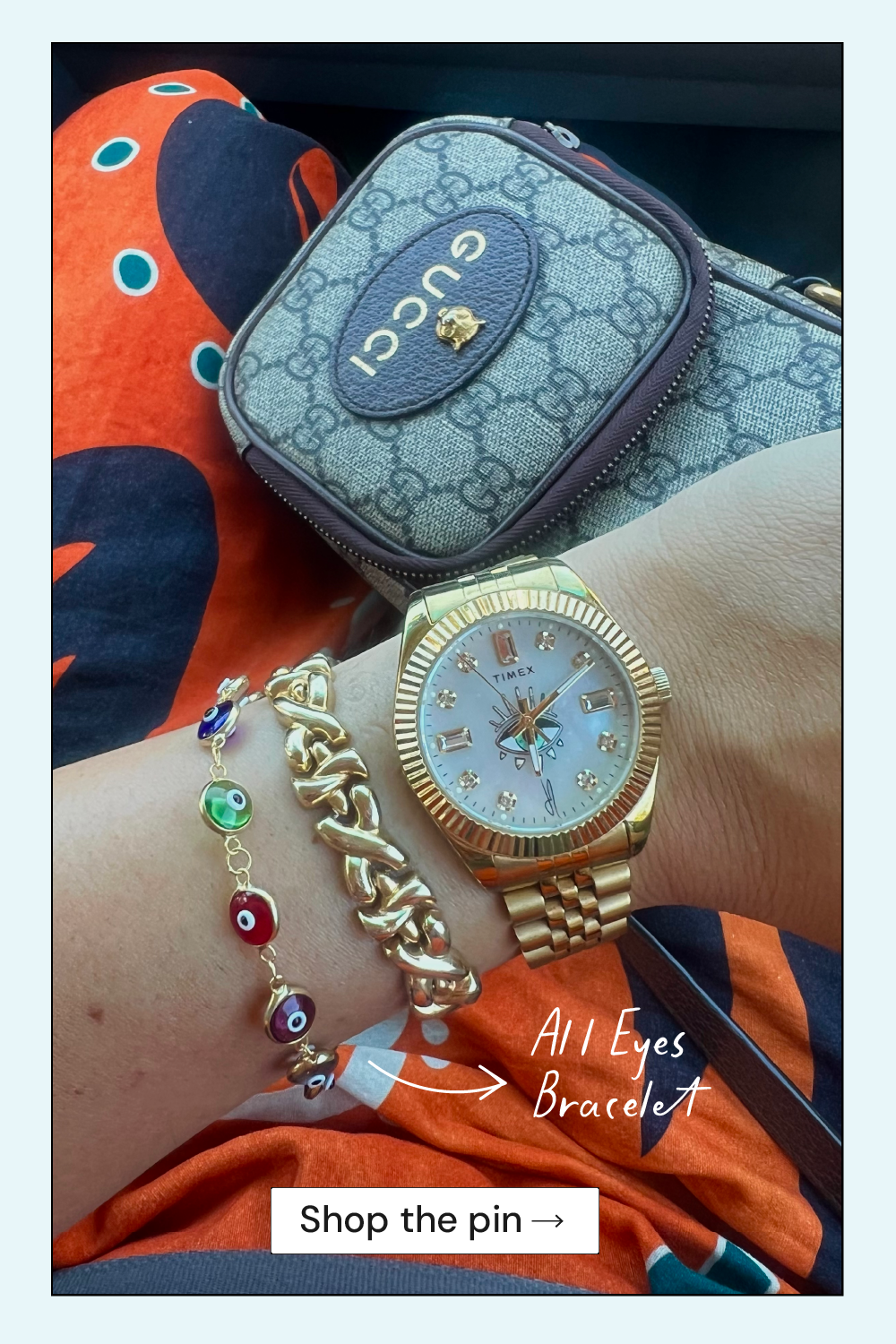 Gold watch and colorful bracelet on a wrist with Gucci case in the background