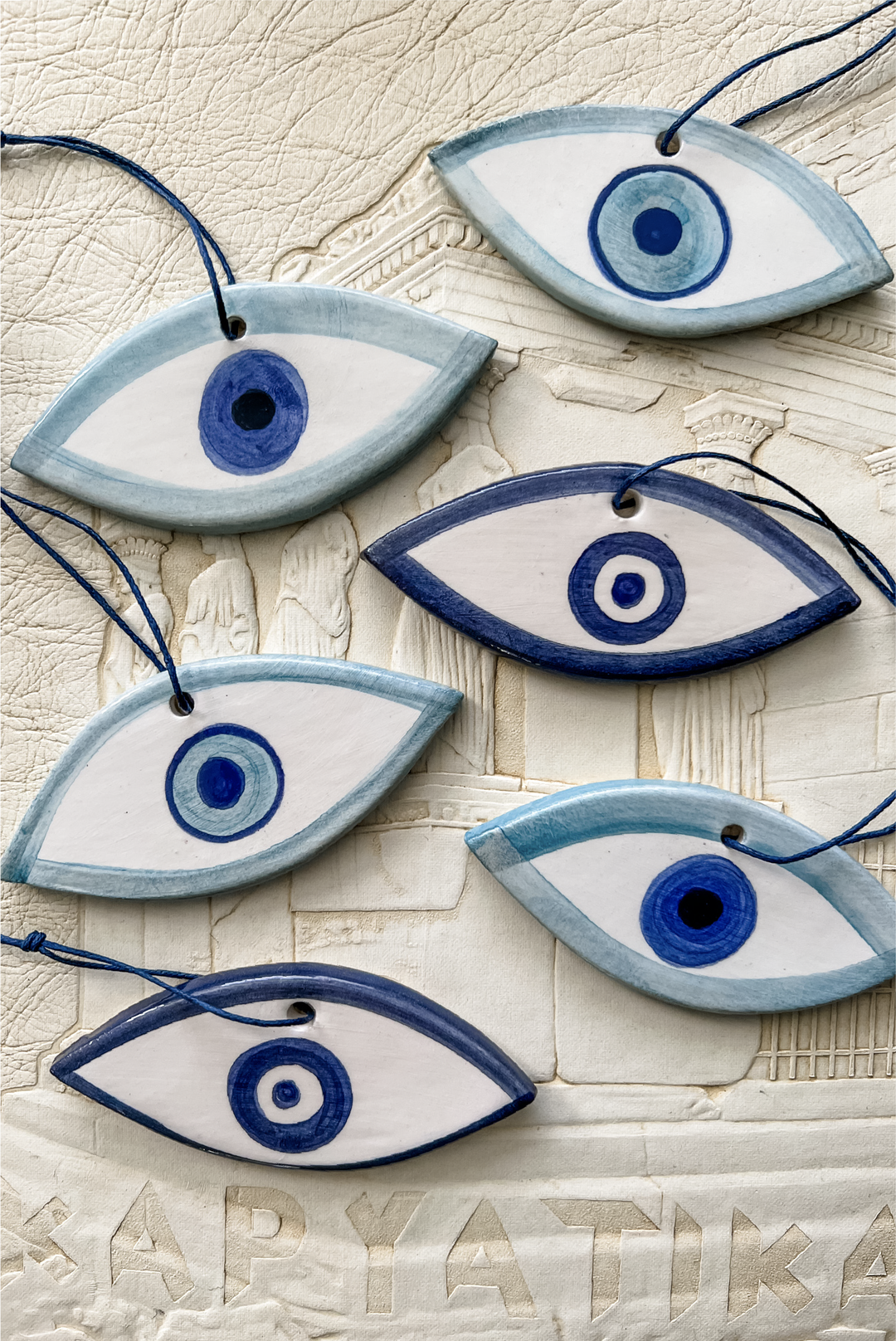 Ceramic Mati Charm made by Greek brand Roussos Ceramics, sold by Selini.