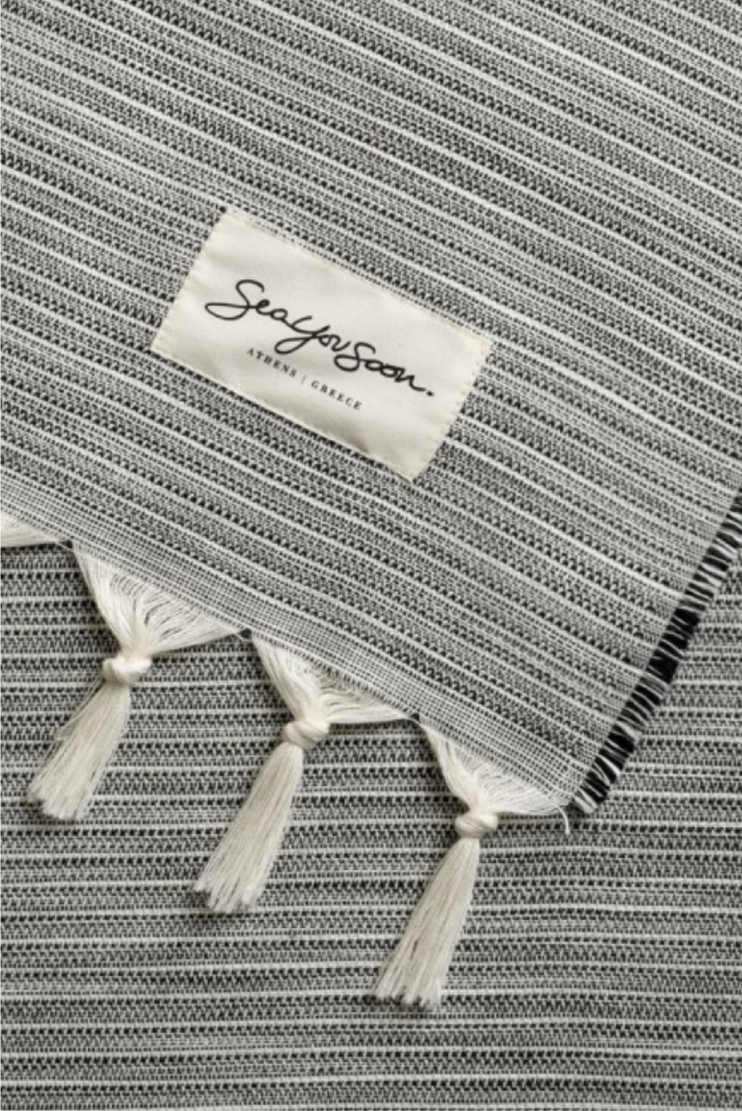 Fino Towel in Black made by Greek brand Sea You Soon, sold by Selini.